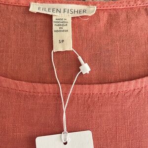 Eileen Fisher salmon colored dress size Small, but runs larger.